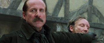 Movie still from “Hansel & Gretel: Witch Hunters” (2013), directed by Tommy Wirkola – A man with a mustache and a beard; Close Up shot, Low angle