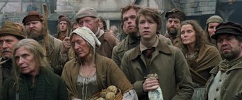 Movie still from “Hansel & Gretel: Witch Hunters” (2013), directed by Tommy Wirkola – A group of people standing next to each other; Medium shot, Low angle