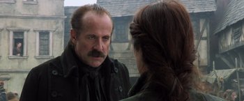 Movie still from “Hansel & Gretel: Witch Hunters” (2013), directed by Tommy Wirkola – A man looking at a woman in a mirror; Close Up shot, Over the shoulder angle