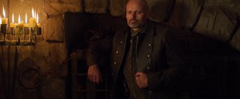 Movie still from “Hansel & Gretel: Witch Hunters” (2013), directed by Tommy Wirkola – A man wearing a leather jacket and tie; Medium shot, Low angle