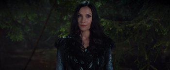 Movie still from “Hansel & Gretel: Witch Hunters” (2013), directed by Tommy Wirkola – A woman with long black hair wearing a black outfit; Close Up shot, Over the shoulder angle