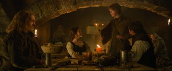 Movie still from “Hansel & Gretel: Witch Hunters” (2013), directed by Tommy Wirkola – A man and a woman in medieval garb in a hut; Medium shot, Low angle