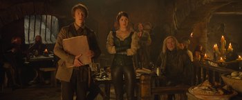 Movie still from “Hansel & Gretel: Witch Hunters” (2013), directed by Tommy Wirkola – A group of people standing around a table; Medium shot, Over the shoulder angle