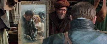 Movie still from “Hansel & Gretel: Witch Hunters” (2013), directed by Tommy Wirkola – A man in a turban looking at a painting of a woman; Medium shot, Over the shoulder angle