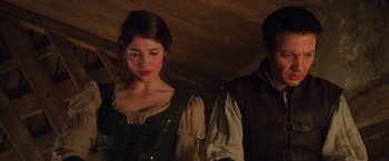 Movie still from “Hansel & Gretel: Witch Hunters” (2013), directed by Tommy Wirkola – A woman in a green dress and a man in a brown jacket; Close Up shot, Low angle
