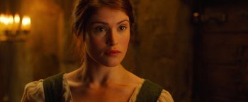 Movie still from “Hansel & Gretel: Witch Hunters” (2013), directed by Tommy Wirkola – A person wearing a dress and looking at the camera; Close Up shot, Over the shoulder angle