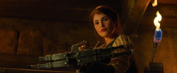 Movie still from “Hansel & Gretel: Witch Hunters” (2013), directed by Tommy Wirkola – A beautiful young woman holding a pair of scissors in her hands; Close Up shot, Low angle