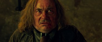 Movie still from “Hansel & Gretel: Witch Hunters” (2013), directed by Tommy Wirkola – An older man with long hair and a beard; Close Up shot, Low angle