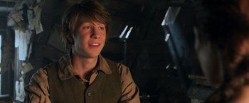 Movie still from “Hansel & Gretel: Witch Hunters” (2013), directed by Tommy Wirkola – A man in a brown vest and a brown shirt; Close Up shot, Over the shoulder angle