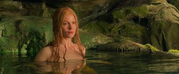 Movie still from “Hansel & Gretel: Witch Hunters” (2013), directed by Tommy Wirkola – A woman with long red hair is in a body of water; Close Up shot, High angle