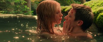 Movie still from “Hansel & Gretel: Witch Hunters” (2013), directed by Tommy Wirkola – A man and a woman in a body of water; Close Up shot, High angle