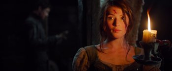 Movie still from “Hansel & Gretel: Witch Hunters” (2013), directed by Tommy Wirkola – A woman with a red cross on her forehead; Close Up shot, Over the shoulder angle
