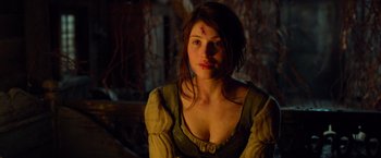 Movie still from “Hansel & Gretel: Witch Hunters” (2013), directed by Tommy Wirkola – A beautiful young woman with a cross on her forehead; Close Up shot, Over the shoulder angle