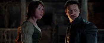 Movie still from “Hansel & Gretel: Witch Hunters” (2013), directed by Tommy Wirkola – A man and a woman standing next to each other; Close Up shot, Over the shoulder angle