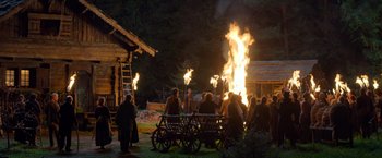 Movie still from “Hansel & Gretel: Witch Hunters” (2013), directed by Tommy Wirkola – A group of people standing around a fire; Extreme Wide shot, High angle