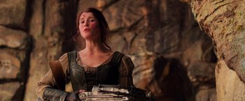 Movie still from “Hansel & Gretel: Witch Hunters” (2013), directed by Tommy Wirkola – A woman in a medieval dress holding a gun; Medium shot, Low angle