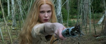 Movie still from “Hansel & Gretel: Witch Hunters” (2013), directed by Tommy Wirkola – A woman with long red hair is holding a sword; Close Up shot, Low angle