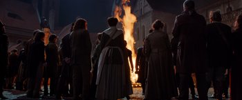 Movie still from “Hansel & Gretel: Witch Hunters” (2013), directed by Tommy Wirkola – A group of people standing around a bonfire; Wide shot, Low angle