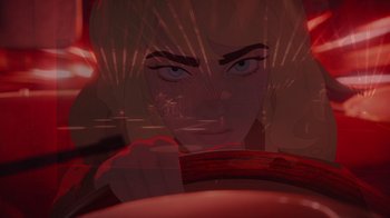 Movie still from “Happier Than Ever: A Love Letter to Los Angeles” (2021), directed by Patrick Osborne – A woman driving a car with a red light behind her; Close Up shot, Over the shoulder angle