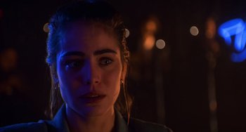 Movie still from “Hard Target” (1993), directed by John Woo – A person wearing a jacket; Close Up shot, Over the shoulder angle