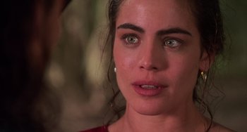 Movie still from “Hard Target” (1993), directed by John Woo – A person with green eyes; Close Up shot, Over the shoulder angle