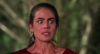 Movie still from “Hard Target” (1993), directed by John Woo – A person with eyes wide open; Close Up shot, Low angle