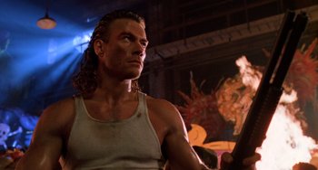 Movie still from “Hard Target” (1993), directed by John Woo – A person wearing a tank top; Close Up shot, Low angle