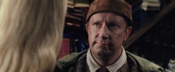 Movie still from “Harry Potter and the Chamber of Secrets” (2002), directed by Chris Columbus – A person wearing a hat; Close Up shot, Over the shoulder angle