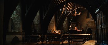 Movie still from “Harry Potter and the Chamber of Secrets” (2002), directed by Chris Columbus – A room filled with lots of tables and chairs; Extreme Wide shot, High angle