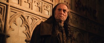 Movie still from “Harry Potter and the Chamber of Secrets” (2002), directed by Chris Columbus – An old man with long hair and a beard; Close Up shot, Low angle