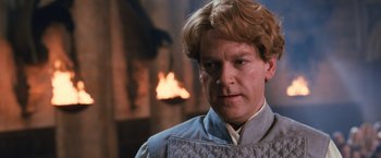 Movie still from “Harry Potter and the Chamber of Secrets” (2002), directed by Chris Columbus – A person with a fire in the background; Close Up shot, Low angle