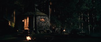 Movie still from “Harry Potter and the Chamber of Secrets” (2002), directed by Chris Columbus – A man standing in front of a stone cabin; Extreme Wide shot, High angle