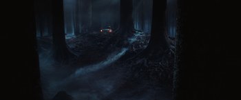Movie still from “Harry Potter and the Chamber of Secrets” (2002), directed by Chris Columbus – A car is driving through a dark forest; Extreme Wide shot, High angle