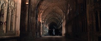 Movie still from “Harry Potter and the Chamber of Secrets” (2002), directed by Chris Columbus – People are walking through a cathedral like hallway; Extreme Wide shot, High angle