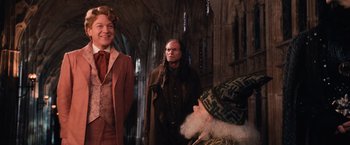 Movie still from “Harry Potter and the Chamber of Secrets” (2002), directed by Chris Columbus – A group of people standing next to each other in a room; Medium shot, Over the shoulder angle