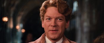 Movie still from “Harry Potter and the Chamber of Secrets” (2002), directed by Chris Columbus – A person wearing a suit and tie; Close Up shot, Low angle
