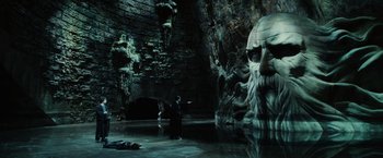 Movie still from “Harry Potter and the Chamber of Secrets” (2002), directed by Chris Columbus – Two people are swimming in the water in a cave; Extreme Wide shot, Over the shoulder angle