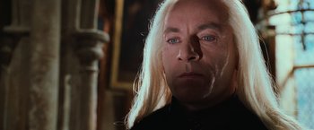 Movie still from “Harry Potter and the Chamber of Secrets” (2002), directed by Chris Columbus – A person with long white hair; Close Up shot, Low angle