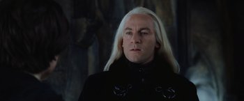 Movie still from “Harry Potter and the Chamber of Secrets” (2002), directed by Chris Columbus – Lucius malfoy wearing a black jacket; Close Up shot, Low angle