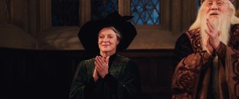 Movie still from “Harry Potter and the Chamber of Secrets” (2002), directed by Chris Columbus – An older woman wearing a black witch's hat; Medium shot, Low angle