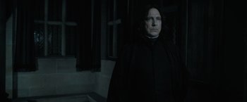 Movie still from “Harry Potter and the Deathly Hallows: Part 1” (2010), directed by David Yates – Severus snape in a dark room with a window in the background; Close Up shot, Low angle