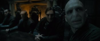 Movie still from “Harry Potter and the Deathly Hallows: Part 1” (2010), directed by David Yates – Two people sitting next to each other in a dark room; Close Up shot, Over the shoulder angle