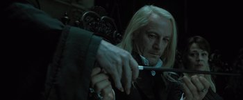 Movie still from “Harry Potter and the Deathly Hallows: Part 1” (2010), directed by David Yates – Lucius malfoy holding a sword; Close Up shot, Over the shoulder angle
