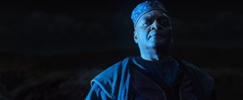 Movie still from “Harry Potter and the Deathly Hallows: Part 1” (2010), directed by David Yates – An older man wearing a blue hat and a blue robe; Close Up shot, Low angle