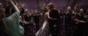 Movie still from “Harry Potter and the Deathly Hallows: Part 1” (2010), directed by David Yates – Two people dancing in front of a group of people; Wide shot, Over the shoulder angle