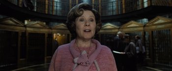 Movie still from “Harry Potter and the Deathly Hallows: Part 1” (2010), directed by David Yates – A person wearing a pink sweater; Close Up shot, Low angle