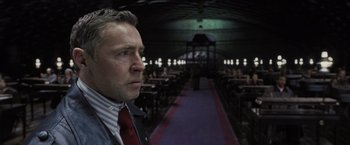 Movie still from “Harry Potter and the Deathly Hallows: Part 1” (2010), directed by David Yates – A man standing in front of an empty room; Close Up shot, Low angle