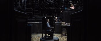 Movie still from “Harry Potter and the Deathly Hallows: Part 1” (2010), directed by David Yates – A person sitting in a chair in a room; Wide shot, High angle