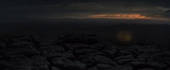 Movie still from “Harry Potter and the Deathly Hallows: Part 1” (2010), directed by David Yates – A view of a mountain range at night with the sun going down in the distance; Extreme Wide shot, Low angle
