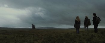 Movie still from “Harry Potter and the Deathly Hallows: Part 1” (2010), directed by David Yates – A large field with a tall rock in the middle of it; Extreme Wide shot, Low angle